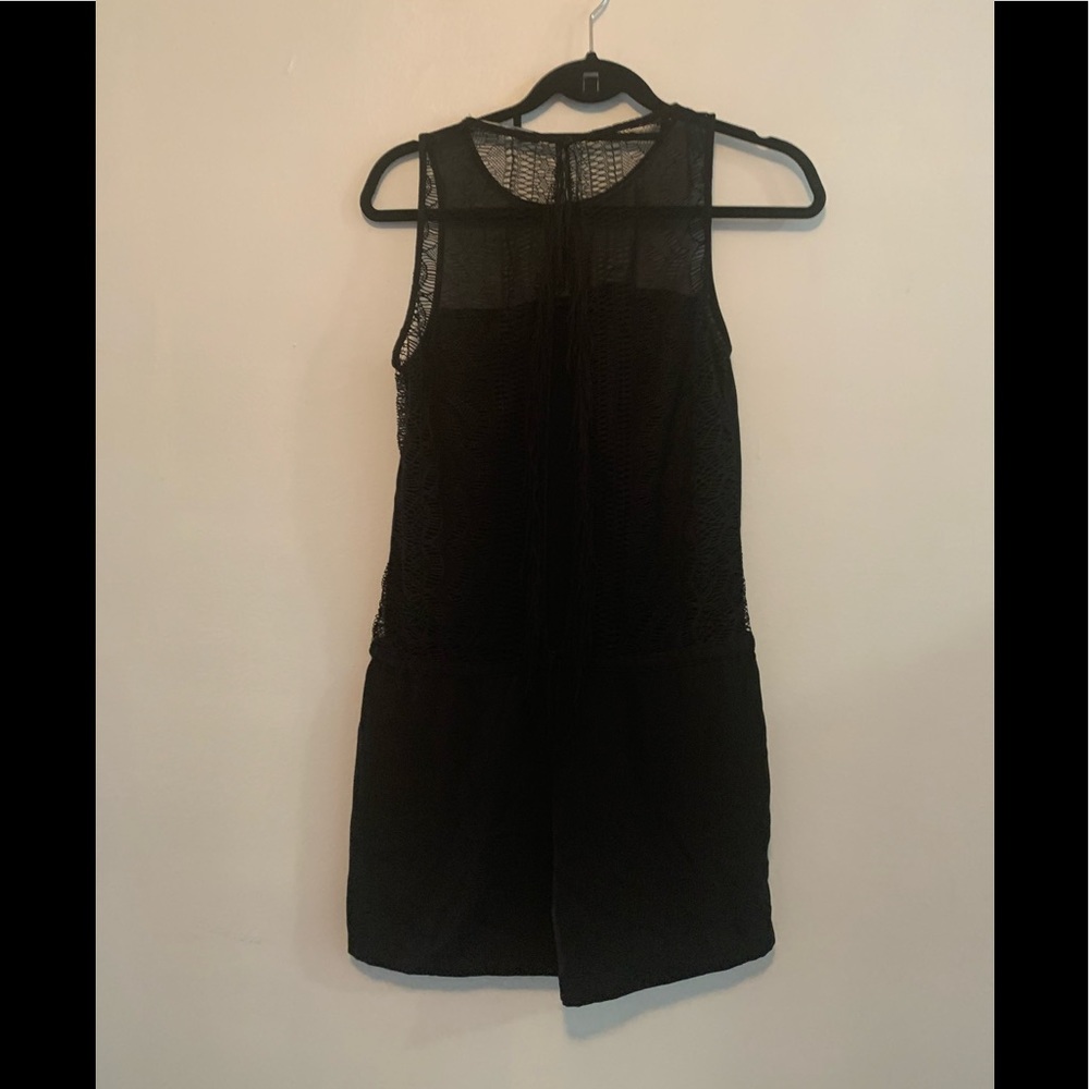 Black Romper with lace meshing at the back and draw string in the waist.